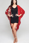 Model wearing red chiffon kimono with floral prints front profile